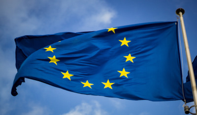 The EU flag flying in the sky.