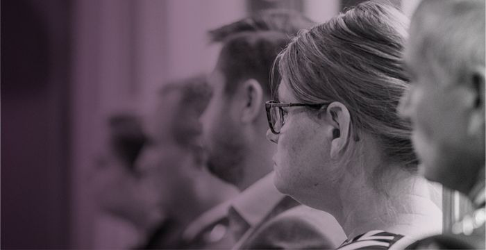 Faces in profile, pinkish picture.