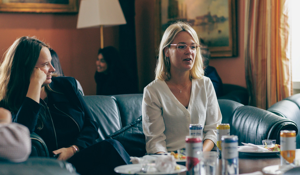 Female students sitting in a sofa in the Officers' Mass.