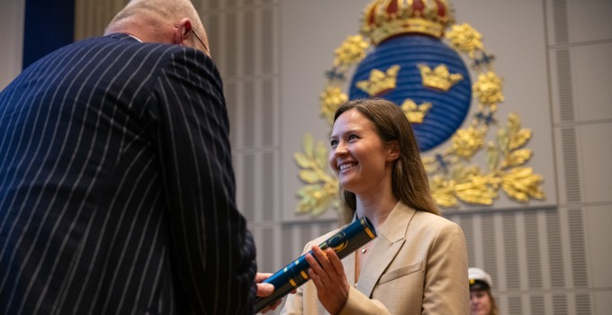 Graduate receiving a diploma.