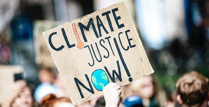 Close up of participants in a demonstration against the climate crisis. 